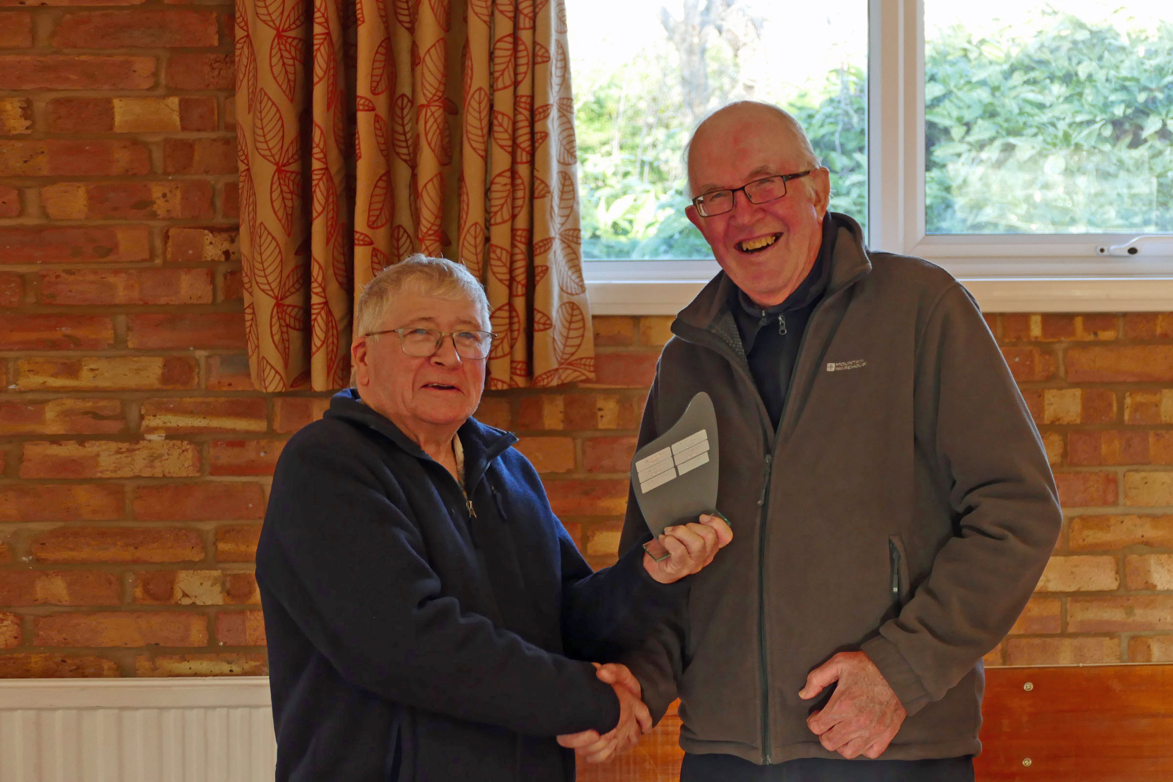 Mick Page collecting the Victor Ludorum trophy at the PMFC 2025 AGM. Mick also have a top tip for winners of PMFC trophies: make sure the front of the trophy is facing the camera, Ops!