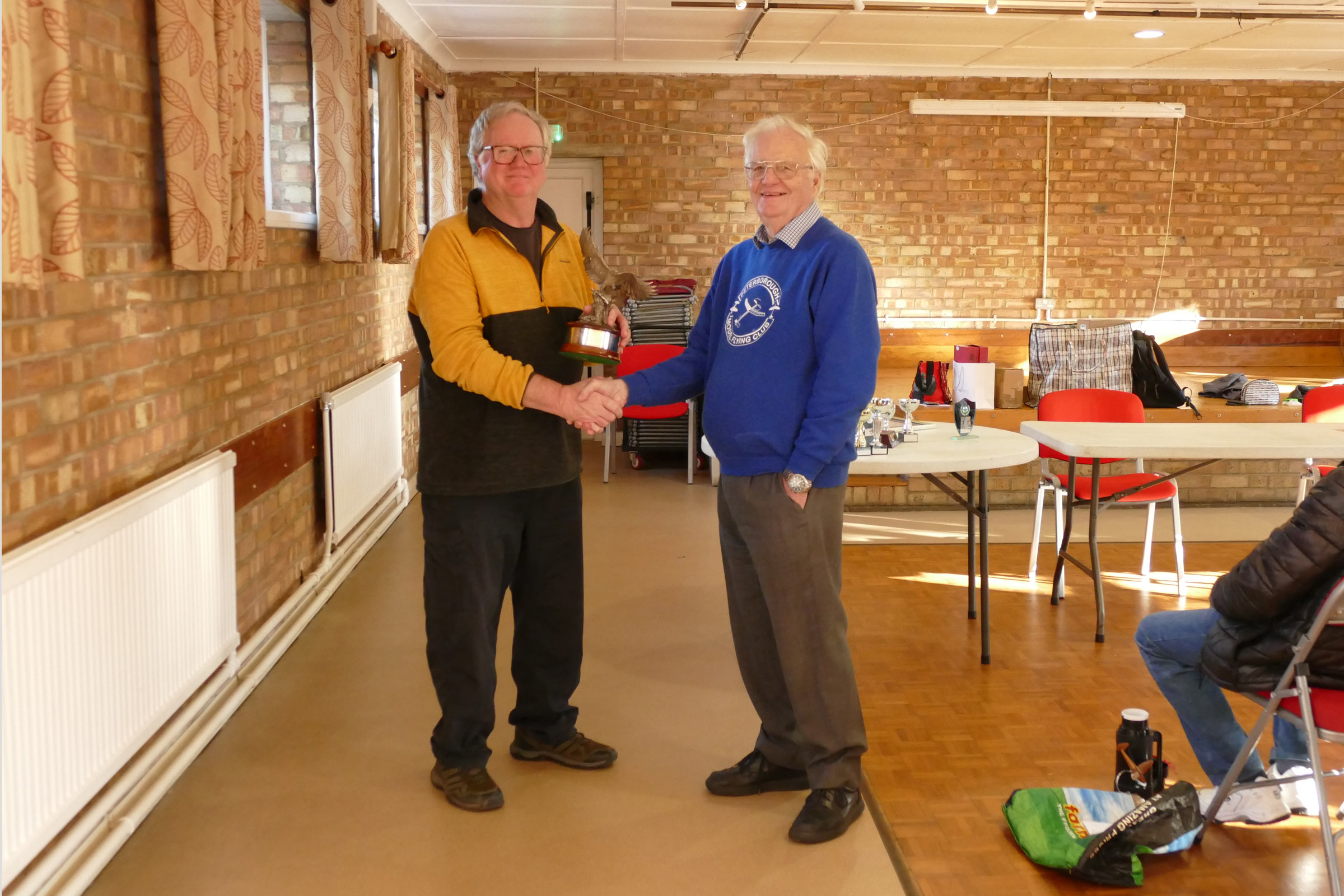 Andy Green receives the Eric Young trophy for the 3rd year running for all his excellent committee work on behalf of the PMFC 2025 AGM. 