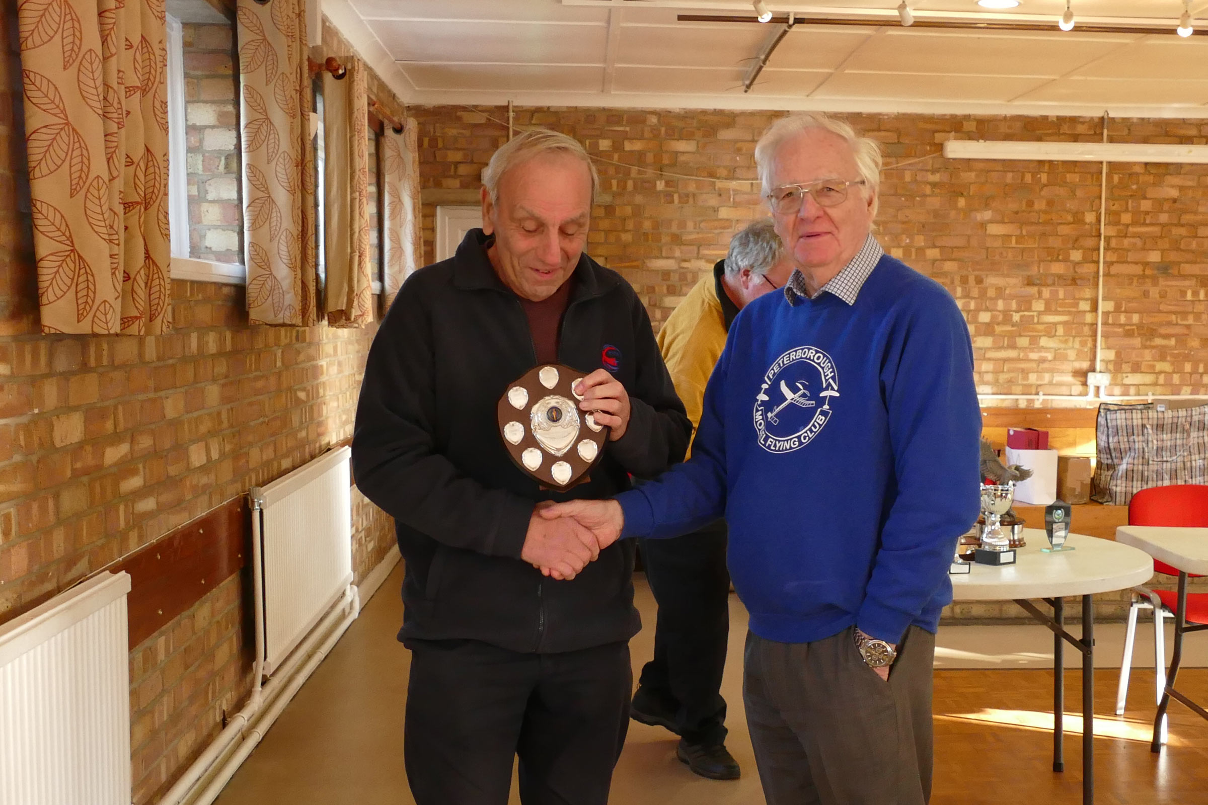 Pete Gibbons collects the Free Flight Trophy from our President Brian Waterland at the PMFC 2025 AGM.